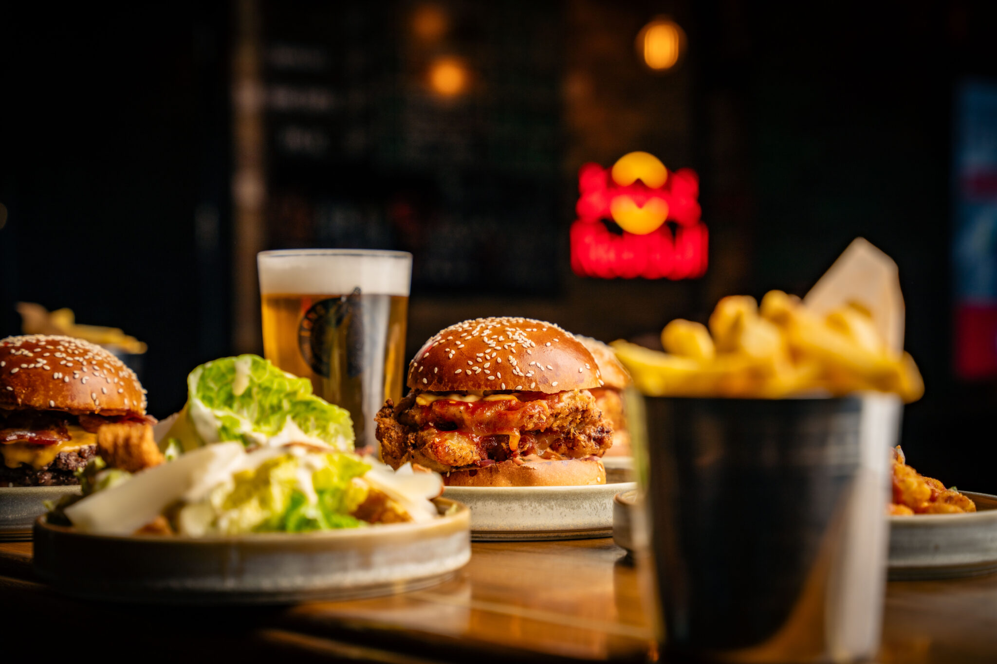 a table that has burger and chips on it